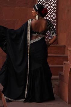 Black pre-draped saree with organza ruffle border detailing. Paired with an elbow sleeves phool garden woven brocade blouse with a flattering boat neckline and a kiran lace border embroidered dupatta. - Aza Fashions Elegant Fitted Pre-draped Saree For Navratri, Elegant Pre-draped Saree For Festivals, Elegant Festive Dupatta With Ruffles, Elegant Pre-draped Saree With Ruffles For Navratri, Elegant Draped Sharara For Diwali, Elegant Ruffled Dupatta For Festive Occasions, Elegant Festival Blouse Piece With Ruffles, Elegant Ruffled Blouse Piece For Festivals, Elegant Black Pre-draped Saree