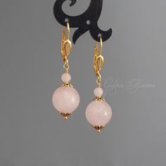 "Rose Quartz Earrings Pink Love Stone Earrings Gold Plated Leverbacks round pink stone earrings Gift Jewelry Length approx. 48mm (2\") Width: approx. 12mm (1/2\") Rose Quartz Gemstone Gold Plated Leverback and spacers Accepted payments:  1)-PayPal,  2)-Credit/Debit Card through PayPal   HOW TO PAY WITH CREDIT CARD THROUGH PAYPAL:  1)Click \"Check out with PayPal\" ( even if you don't have PayPal account).  2)Choose \"Pay with Credit/Debit Card. You can do it in guest mode without owning/creating Pink Gemstone Dangle Jewelry, Elegant Round Pendant Earrings With Ear Wire, Rose Gold Round Crystal Earrings For Pierced Ears, Rose Gold Round Crystal Earrings, Pink Gemstone Drop Earrings, Rose Gold Round Earrings With Ear Wire, Adjustable Round Rose Quartz Jewelry, Pink Gold Dangle Earrings For Pierced Ears, Elegant Pink Dangle Hoop Earrings