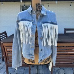 Nwt Vigoss Denim Faux Leather Fringe Jacket Size Small Could Fit A Medium Msrp $169 Nwt 100% Cotton Oversized Festival Boho Western Jean Denim Trending Add Some Bohemian Flair To Your Wardrobe With This Denim Jacket. This Mid-Length Jacket Features Long Sleeves, A Button Closure And A Relaxed Fit. The Fringe Accents Give A Retro Cowgirl Vibe. Fringe Jean Jacket, Leather Fringe Jacket, Retro Cowgirl, Fringe Jeans, Western Jeans, Fringe Leather Jacket, Western Jacket, Fringe Jacket, Denim Trends