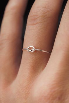 This stacking Knot ring is really cute and easy to wear! The open wire knot adds a bit of extra detail to this otherwise simple hammered stacking ring. This is one single length of metal that is knotted into a secure, open knot and soldered around the back. This ring is a great alternative to a stacking ring! This list Simple Ring Design, Delicate Silver Rings, Silver Rings Simple, Silver Ring Designs, Sterling Silver Stacking Rings, Single Ring, Silver Stacking Rings, Knot Ring, Everyday Rings