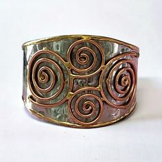 Hammered Design Dual Tone Wide Cuff Bracelet, Nwt Spiral Metal Cuff Bracelet As Gift, Handmade Adjustable Spiral Cuff Bracelet, Bohemian Wide Band Adjustable Bracelets, Bohemian Wide Band Adjustable Bracelet, Unique Adjustable Wide Band Bangle, Adjustable Red Metal Cuff Bracelet, Red Adjustable Metal Cuff Bracelet, Unique Adjustable Wide Band Cuff Bracelet, Handmade Adjustable Wide Band Bracelet