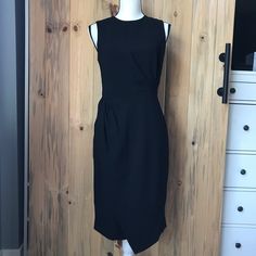 New. Never Worn. Fitted. Zip Closure And Hook-Eye In Back. Lining Top. Material: Shell: 70% Triacetate, 30% Polyester, Lining: 100% Polyester. Flat Measurement: From Front Neck To Hem (Longest Point) Approx. 39 Inches Long. No Trades, No Holds Elegant Asymmetrical Dress For Work, Sleek Black Sleeveless Asymmetrical Dress, Fitted Midi Dress With Asymmetrical Hem For Office, Black Asymmetrical Midi Dress For Office, Chic Fitted Asymmetrical Dress For Office, Fitted Asymmetrical Dress For Work, Asymmetrical Sheath Dress For Work, Asymmetrical Fitted Dress For Work, Chic Asymmetrical Dress For Work