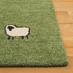 a rug with a black and white sheep on it