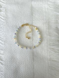 FOR OTHER DAINTY BEADED BRACELETS: https://www.etsy.com/ca/shop/ArtiChouXCanada?ref=seller-platform-mcnav%C2%A7ion_id&section_id=46088511 Bracelet Length: 13-18cm (5.1-7 inches) with a 14k gold filled extender. This bracelet features an array of summer themed pastel colors: blue, white, cream, and light purple Japanese seed beads.  Thread may be visible since it is a handmade product   SIZING  Wrap a soft measuring tape snugly around the widest part of your wrist. Add 1.27cm (0.5in) to that meas Dainty White Beaded Crystal Bracelet, Dainty Blue Bracelets With Faceted Beads, Elegant Blue Beaded Friendship Bracelets, Pastel Beaded Bracelets Gift, Pastel Beaded Bracelets For Gift, Elegant Blue Friendship Bracelets With Colorful Beads, Elegant Blue Friendship Bracelets With Round Beads, Light Blue Beaded Bracelets As Gift, Adjustable Pastel Beaded Jewelry