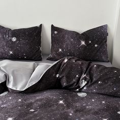 a bed with black and white stars on it