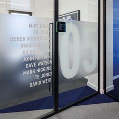 an office door with the number 50 etched into it's glass front and side