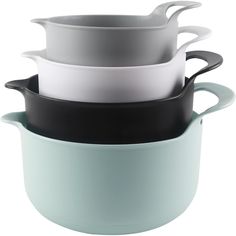 three bowls stacked on top of each other in different colors and sizes, one with black rim