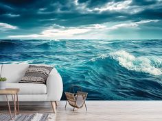 a living room scene with the ocean wallpaper