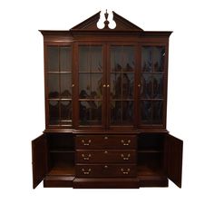 a wooden china cabinet with glass doors on the top and bottom drawers, in dark wood