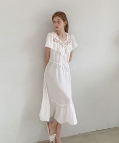 Calf-length dress in soft, comfortable fabric. Lace-trimmed v-neck, short sleeves, and narrow string waist tie. Unlined.- A-line- Midi- Short sleeve- V-neck Flowy V-neck Midi Dress With Lace Trim, White V-neck Loungewear Dress, Flowy V-neck Midi Dress For Loungewear, Summer V-neck Ruffled Sleepwear, Summer V-neck Sleepwear With Ruffles, Elegant V-neck Sleepwear For Vacation, Feminine V-neck Nightgown For Spring, Feminine V-neck Maxi Dress With Tie Waist, White V-neck Maxi Dress For Loungewear