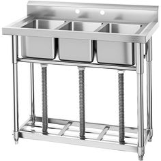 three compartment stainless steel sink with two drainers on each side and one drainer at the bottom