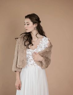 This Rabbit Fur jacket is a lavish accessory for those looking to dress up an outfit. Inspired by a design from the 1960s, this lightweight jacket's clean lines are the perfect garment to dress up any outfit. Clean box collar with straight front design Sits softly agains the body & incredibly soft to touch Hook/eye closure all the way down the front Perfect for the bride or anyone in the bridal party Made from ethically sourced 100% Rabbit Fur Hand Knit Lightweight No lining By-Product Materials Statement Wardrobe, Silk Bridal Robe, Rabbit Fur Jacket, Blush Cream, Feather Jacket, Bridal Jacket, Wedding Jacket, Bride Look, White Bridal