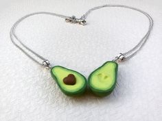 "This is a super adorable BFF necklace for 2 friends. An original gift and amazing way to show your feelings to your friend for any special occasion. THE SET INCLUDES: Two green avocado necklace with two chains of your choice. These realistic avocado charms are made entirely by hand from polymer clay with much of love and attention to every detail. The size of the avocado is 3 cm/ 1.8 cm - approx 1.2\"/ 0.7\" I offer these necklaces with 925 sterling silver chain, 925 sterling silver plated chai Cute Adjustable Necklaces For Best Friend Gift, Cute Green Jewelry For Valentine's Day, Novelty Jewelry For Birthday And Mother's Day, Handmade Necklaces For Best Friend Gift On Valentine's Day, Handmade Necklace For Best Friend Gift On Valentine's Day, Novelty Jewelry Gift For Mother's Day, Novelty Jewelry For Mother's Day Gift, Novelty Necklaces For Valentine's Day Gift, Novelty Pendant Charm Necklace For Gift