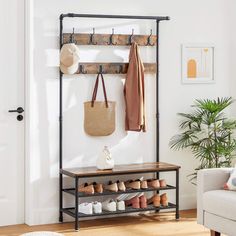 a coat rack with shoes and bags hanging on it