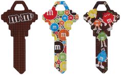 three key shaped like the characters from sesame and m & m are shown in different colors