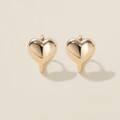 Heart goes padam padam in these hoops. Boo’s chubby heart motif, set on a 6mm huggie, are the sweetest addition to your ear stack. Minimal, sophisticated and chic, these shapely hoops will have hearts skipping beats. Created for you in the finest 14 karat gold, you'll want to wear these earrings always and never take them off, even when working out or in the shower. Elegant Huggie Earrings With Heart Charm, Elegant Double Heart Huggie Earrings With Heart Charm, Elegant Heart Huggie Earrings For Everyday Wear, Valentine's Day Minimalist Huggie Earrings, Everyday Huggie Heart Earrings With Charm, Huggie Earrings With Heart Charm For Anniversary, Everyday Huggie Heart Earrings, Minimalist Huggie Heart Earrings For Anniversary, Yellow Gold Heart Huggie Earrings