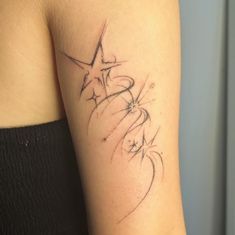 a woman with a star tattoo on her arm