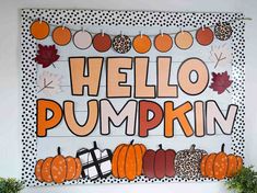 a bulletin board with pumpkins and leaves on it that says hello pumpkin written in large letters