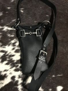 Cross bag made in black leather with buckle shoulder strap and D ring snaffle bit on the front.  Fits an iPhone or wallet and sometimes both. Snaffle Bit, Beige Bag, Black Bead Necklace, Sling Bags, Cross Bag, Essential Bag, Beaded Bags, D Ring, Phone Bag