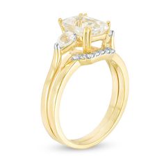 Take her breath away with this luxurious bridal set. Crafted in sterling silver with 14K gold plate, the exquisite engagement ring showcases a sparkling 8.0 x 6.0mm emerald-cut lab-created white sapphire flanked by 3.0 x 4.0mm pear-shaped created sapphires. On your wedding day, complete her look with the coordinating contoured band shimmering with petite round created sapphires. Polished to a bright shine, this bridal set is destined to be admired. Custom-made to fit her ring size. Sterling silver rings cannot be resized after purchase. Her Ring, Peoples Jewellers, Emerald Stone, Sapphire Stone, Bridal Set, White Sapphire, Bridal Sets, Three Stone, On Your Wedding Day