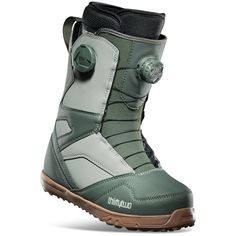 the snowboard boots are green and white