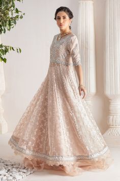 Step up your festive dressing game with our beautifully crafted kalidar over a canvas of stunning embroidered organza, heavily embellished with sequins, beads, crystals, neckline and sleeves beautifully adorned with gorgeous zardozi, mirror work & Resham thread work. Stunning hand-made stylized tassel details at back. This stunning multi panel kalidar is offset with jamawar Lehanga with gorgeous ruffle details & net dupatta featuring sequins & mirror motifs and chan, trimmed with mirror embroidered borders , a Must- have wardrobe staple to carry all Wedding Festivities in effortless style. Shirt Fabric: Pure embroidered Organza & Silk Net Lehanga Fabric: Jamawar Dupatta Fabric: French Net Color: Shell Pink This outfit is only available in Custom size, once order is placed design team will Designer Outfit, Wedding Festivities, Shell Pink, Embroidered Organza, Net Dupatta, Pakistani Designers, Shirt Fabric, Mirror Work, Festival Dress