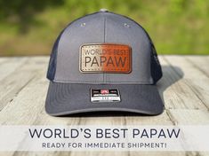 The World's Best Papaw would love this custom Richardson 112 Trucker style snapback hat for his birthday, Father's Day, Christmas, or just because! And what a cute way to make a pregnancy announcement! This hat is Charcoal Grey/Black and features a WORLD'S BEST PAPAW patch and is READY TO SHIP Richardson 112 Adjustable Snapback Trucker Cap: - 60/40 cotton/polyester - 100% polyester mesh back - Structured, six-panel, mid-profile - Pre-curved contrast stitched visor - Underbill matches the color o Papaw Gifts, Richardson Hats, Leather Patch Hat, Patch Hat, Leather Patches, Contrast Stitch, Pregnancy Announcement, Snapback Hat, Trucker Cap