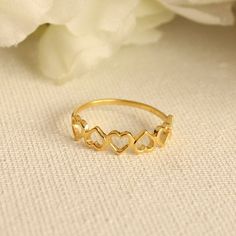 "Gold Multiple Heart Outline Eternity Band available in 10K, 14K, 18K - Yellow Gold, White Gold, Rose Gold. Approximate product detail for 14K Gold Ring (Gold Weight will vary depending on the caratage and ring Size) Gold Details: Gold : 14K Yellow Gold Gold Weight : 1.131 gms Timelessly beautiful and minimal, it can be combined with any look and can be worn for really every occasion. ----------------------------------------- Cleaning and Care: Use Soft Cotton Cloth to clean the piece. --------- Cheap Gold Rings For Valentine's Day, Gold Heart Ring Suitable As A Gift, Gold Plated Heart Ring For Gift, Cute Gold Heart Ring For Valentine's Day, Gold Heart Ring Hallmarked For Valentine's Day, Valentine's Day Yellow Gold Heart Ring, Love Ring Gold, Gold Love Ring, Heart Ring Gold