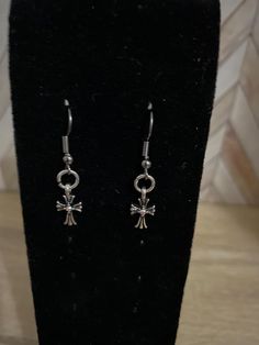 Hand made across  Themed Earrings made with Wire Findings and an assortment charms Nickel-free Metal Cross Earrings, Symbolic Hypoallergenic Drop Earrings, Hypoallergenic Symbolic Drop Earrings, Cross Shaped Metal Earrings For Pierced Ears, Nickel Free Adjustable Cross Earrings, Handmade Metal Cross Earrings, Nickel-free Cross Earrings As Gift, Symbolic Metal Dangle Earrings, Metal Symbolic Hypoallergenic Earrings