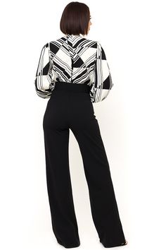 The Black and White Jumpsuit by Bella Chic is the total package, elegant, classic, and stunning! You’ll look completely irresistible in this one piece outfit. Go from career to cocktails in this long sleeve jumpsuit! This black and white jumpsuit starts with a v neck design and a fitted waist top that flows into relaxed wide leg pants, while a waist cinching belt completes this look! This jumpsuit is made of a stretch knit fabric that shapes and hugs your curves. The black and white jumpsuit is Elegant Long Sleeve Jumpsuits And Rompers For Evening, Chic Long Sleeve Pantsuit For Fall, Elegant Fitted Long Sleeve Jumpsuits And Rompers, Elegant Long Sleeve Pantsuit For Fall, Elegant Long Sleeve Fall Pantsuit, Elegant Long Sleeve Fitted Jumpsuit, Classic Long Sleeve Evening Pantsuit, Chic Formal Jumpsuits And Rompers For Fall, Elegant Jumpsuits And Rompers For Evening In Fall