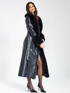 Indulge in opulence with our high quality Zaida Black Vegan Fur Trim Vegan Leather Coat. This stunning maxi coat exudes luxury, adorned with puffy fur trim along the neckline and sleeve openings. Crafted from premium vegan leather and soft vegan fur, it is fully lined for comfort. The coat features a large snap inside the center waist, along with belt loops and a slender leather belt for effortless closure. Versatile and chic, it adds a touch of sophisticated glamour to any special occasion. Cho Chic Black Fur Coat With Feather Trim, Black Formal Outerwear With Feather Trim, Formal Black Outerwear With Feather Trim, Chic Black Fur Coat With Faux Fur Trim, Luxury Long Sleeve Fur Coat For Evening, Luxury Evening Fur Coat, Black Fur Coat With Faux Fur Trim For Party, Luxury Belted Fur Coat For Fall, Luxury Formal Outerwear With Feather Trim