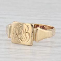 Metal: 18k Yellow Gold  Weight: 3.2 Grams  Stamps: British Hallmarks Face Height: 8.6 mm  Rise Above Finger: 0.9 mm Band / Shank Width: 3.1 mm This ring is a size 8, but it can be resized down 3 sizes for a $30 fee or up 3 sizes for a $50 fee. If you would like your ring resized, please select the appropriate fee from the listing below in order to pay the sizing fee: https://www.etsy.com/listing/781388346/ring-sizing-service-fee Each piece is thoroughly examined and refinished as needed by our professional jewelers, graded by our in-house GIA (Gemological Institute of America) Graduate Gemologist, and inspected for quality before being carefully packaged and promptly shipped. [SKU: B35329] phd 14k Yellow Gold Rectangular Jewelry, Antique Signet Ring For Formal Occasions, Classic Yellow Gold Signet Ring With Maker's Mark, Gold Engraved Ring With Maker's Mark As Gift, Gold Engraved Ring With Maker's Mark For Gift, Heirloom Signet Ring With Maker's Mark For Formal Occasions, Heirloom Style Formal Signet Ring With Maker's Mark, Gold Signet Ring With Maker's Mark, Gold Round Signet Ring With Maker's Mark