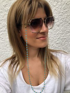 Sunglasses chain from a unique rosary with turquoise beads and gold chain. You can put it in every pair of sunglasses that you wish. In Christina Christi Jewels store you can see a lot of fashion accessories for men and women. You can have them in 2-4 Days with DHL EXPRESS SHIPPING - Rosary Chain with turquoise beads and gold chain that is made from metal. - You can choose in three different dimensions for your glasses. (70 - 80 - 90 cm) # FIND ALL MY DESIGNS IN GLASSES CHAINS HERE: https://etsy Blue Beaded Glasses Chain For Beach, Bohemian Gold Beaded Glasses Chains, Trendy Turquoise Beaded Chain Jewelry, Bohemian Blue Beaded Glasses Chains, Blue Adjustable Chain Glasses Chains For Summer, Blue Adjustable Glasses Chain For Summer, Summer Blue Glasses Chain With Adjustable Feature, Sunglass Chain, Rosary Chain