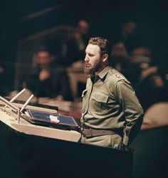 a man in uniform standing at a podium