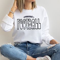 This Football Mom Sweatshirt is the perfect way to show your support for your favorite player on game day! Welcome to my store! **Please Note- this sweatshirt runs true to the size guide provided. If you would like it oversized, please size up** Ideal for any situation, a unisex heavy blend crewneck sweatshirt is pure comfort. These garments are made from polyester and cotton. This combination helps designs come out looking fresh and beautiful. The collar is ribbed knit, so it retains its shape Long Sleeve T-shirt For Baseball Game Day, Sports Fan Crew Neck Top For Game Day, Game Day Sports Fan Crew Neck Top, Football Season Long Sleeve T-shirt With Team Logo, Varsity Crew Neck Top For Football Season, Long Sleeve Football Season T-shirt With Team Logo, Long Sleeve T-shirt With Team Logo For Football Season, Crew Neck Tops For Football Season Game Day, School Spirit Crew Neck Top For Football Season