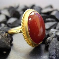 ARTSMYRNA METAL: 925k Silver GEM: Carnelian ( lab created ) Diameter Stone Size: 14x10 mm COATING: 24k gold over (We can made a special type of coating for your personal preference ) MATERIEL : 925K Sterling Silver ( Some of my items vermeil gold over silver for looks rich . But i can finish in silver too ) RING SIZE: 6 (your desired size is made) SPECIAL ORDER IS MADE. If you send us a photo of your desired model (you can send your gem.) We can do it for you. We can make any design you want wit Carnelian Ruby Ring With Oval Cabochon For Gift, Oval Agate Ruby Ring For Anniversary, Heirloom Carnelian Oval Rings, Oval Agate Hallmarked Rings, Classic Chalcedony Rings As Gift, Oval Cabochon Agate Ring For Anniversary, Antique Carnelian Ring As A Gift, Wedding Agate Rings With Polished Finish, Elegant Carnelian Rings For Wedding