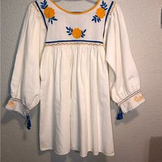 Kimili Embroidery Blouse Or Dress New With Tags, Floral Embroidered Roll Tab Sleeve Size Medium Women’s, Cream Light, Blue Floral, Gorgeous White Peasant Embroidered Long Sleeve Dress, White Long Sleeve Peasant Embroidered Dress, Long Sleeve Embroidered Folk Peasant Dress, Spring Long Sleeve Dress With Embroidered Border, White Peasant Dress With Embroidered Hem, Folk Style Long Sleeve Embroidered Peasant Dress, Folk Style Embroidered Long Sleeve Dress, Folk Style Long Sleeve Dress With Embroidered Neckline, Cotton Embroidered Dress With Floral Embroidery For Brunch