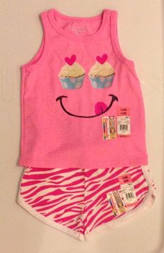 Super cute infant girl's two piece shirt and shorts set, from Garanimals, new with tags! PLEASE NOTE-Shirt is a size 12 months, Shorts are a size 18 months This set features a pink tank with an cupcake smiley face applique and coordinating pink and white animal print knit shorts with an elasticized waist. Shirt, 100% cotton, shorts, 90% cotton, 10% polyester Check out my other items! Be sure to add me to your favorites list! I am always more than happy to combine shipping! Two Piece Shirt, Animal Print Shorts, Face Applique, Shirt And Shorts Set, Pink Cupcakes, Toddler Clothing, Print Shorts, Pink Tank, Knit Shorts