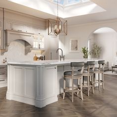 a large kitchen with an island in the middle