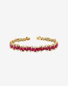 This stylish ruby bangle is handcrafted with an 18-karat spring gold wire, making it flexible and easy to slip on and off. With 4 carats of rubies, it is a beautiful statement piece that can be worn on its own or easily layered with other designs. Details 18k yellow gold or rose gold 4 carats of ruby baguettes 0.42 carats of round white diamonds 7.75mm width Ref: AKB414 Ruby Bangles, Small Rose, Gold Wire, White Diamonds, Eternity Bands, Yellow Color, Diamond White, Or Rose, Statement Pieces