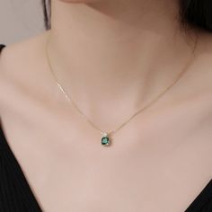 This exquisite pendant necklace showcases a brilliant emerald in a classic solitaire setting, radiating a lush green hue. Its elegant simplicity makes it a standout piece, perfect for enhancing any neckline with a touch of refined sophistication. Elegant Emerald Necklace With Round Pendant, Elegant Emerald Round Pendant Necklace, Elegant Emerald Birthstone Necklace With Round Pendant, Green Fine Jewelry Necklace For Formal Occasions, Minimalist Green Emerald Necklaces, Elegant Emerald Pendant Birthstone Necklace, Fine Jewelry Green Round Necklaces, Green Round Fine Jewelry Necklaces, Elegant Square Pendant Birthstone Necklace