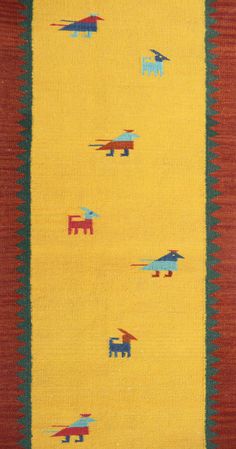 an area rug with elephants and birds on yellow, red, blue and green colors