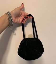 This black velvet evening bag is a great art Deco bag Velvet purse evening bag with lucite 30s 40s style! In good vintage condition has one small brown dye stain and shows wear at base of handles. Non-smoking home. Please contact me with any other questions! Product details: measures 7 1/2 inches wide by 3 inches deep at bottom lucite is 1 1/4 inch wide by 1 inch tall frosted lucite closure is off white to light yellow color Thank you for supporting small business  VISIT MY SHOPS HERE   * http://www.etsy.com/shop/HappyCatHouse * http://www.Etsy.com/shop/AnEnchantingCreature  CONNECT  * http://www.facebook.com/EnchantingCreature * https://instagram.com/enchantingcreature * https://www.pinterest.com/enchantingcreature * @EnchantingCreature  NEW TO ETSY?  A great tutorial to answer all of you Vintage Evening Coin Purse Pouch, Vintage Black Pouch Evening Bag, Black Rectangular Evening Coin Purse, Vintage Black Handheld Evening Bag, Retro Rectangular Coin Purse For Evening, Vintage Pouch Coin Purse For Party, Black Vintage Handheld Clutch, Vintage Handheld Evening Bag, Vintage Handheld Evening Bag For Events