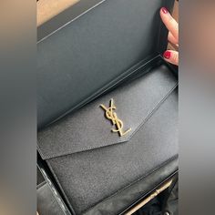 Saint Laurent Uptown Pouch With Gold Hardware Had For 6 Months - Comes With Box In Store For $645 + Tax $550 Or Best Offer Ping Me ! Luxury Envelope Clutch With Gold-tone Hardware, Leather Clutch Bag With Gold-tone Logo Plaque, Leather Pouch Clutch With Gold-tone Hardware, Black Clutch Wallet On Chain With Gold-tone Hardware, Leather Wallets With Gold-tone Hardware In Clutch Shape, Envelope Clutch, Leather Pouch, Gold Hardware, Red Gold