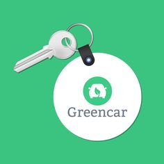 a keychain with the word greencar on it and a dog's head