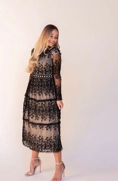 "✨ Welcome to Beekindboutique ✨ This gorgeous Sana Tiered Lace Dress has the most beautiful details ✨ It's perfect for ANY occasion.  -Lace and Crochet Detail  -Midi Length  -Mock Neck -Long Sleeves  -Lined  Model is 5'4 Wearing Size Small. Her measurements are: Bust 32\" Waist 25\" Hips 35.5\" 📣 CARE INSTRUCTIONS  Wash item inside out in cold water, do not bleach, do not dry clean, do not iron directly on the design. Tumble dry only.  - Hand wash or gently machine washable.  - Gentle wash cycl Fall Lace Maxi Dress, Fall Dresses With Lace Sleeves And Maxi Length, Long Sleeve Black Midi Dress For Wedding, Black Long Sleeve Midi Dress For Wedding, Fall Maxi Dress With Lace Sleeves, Black Lace Patchwork Dress For Date Night, Elegant Black Dress With Lace Patchwork, Black Lace Patchwork Dress For Spring, Black Lace Patchwork Maxi Dress