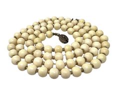 "A very cool antique cream colored beaded and silver necklace.   Super cute necklace, unique in how the beads look, a flat wood toned appearance but also a classic look and can go with anything.  83 cream colored beads with smaller goldish toned beads in between.  The necklace looks like it is made of wood but does not appear to be actual wood.  Measurements: 30\" L Please remember, our items are either pre-owned, vintage or antique & may show signs of wear and use. We try to provide an accurate Necklace Unique, Cute Necklace, White Beads, Made Of Wood, Cream White, Chain Styles, Classic Looks, Long Necklace, Leather Handmade