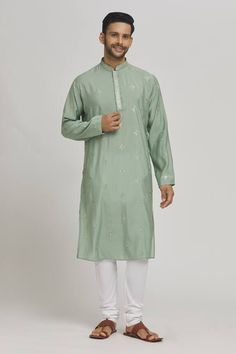 Pastel green kurta with thread embroidered geometric patterns and sequin work embellishments. Comes with churidar. - Aza Fashions Pista Green Kurta With Intricate Embroidery For Festive Occasions, Pista Green Straight Kurta With Intricate Embroidery, Pista Green Traditional Wear With Intricate Embroidery For Eid, Transitional Green Fabric With Resham Embroidery, Green Straight Kurta With Resham Embroidery, Pista Green Kurta With Mirror Work For Eid, Green Embroidered Kurta For Diwali, Green Kurta With Intricate Embroidery For Festivals, Green Straight Kurta With Intricate Embroidery