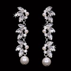 Description: Rhodium plated rhinestone and pearl bead earrings Size: 2.5" L Available Color(s): Silver/Clear/Ivory & Light Gold/Clear/Ivory Pearl Bead Earrings, Bead Earrings, Bridal Earrings, Pearl Beads, Rhodium Plated, Beaded Earrings, Pearl Earrings, Size 2, Plating