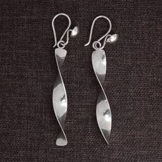 Sterling Silver Dangle Earrings in Twisted Design (2.4 Inch) - Twisted | NOVICA Modern Twist Everyday Earrings, Modern Twist Silver Teardrop Jewelry, Modern Twisted Jewelry With Polished Finish, Modern Twist Twisted Jewelry Gift, Nickel Free Jewelry With A Modern Twist, Twisted Modern Jewelry, Modern Twist Spiral Wrap Earrings As Gift, Modern Wrap Earrings For Pierced Ears As Gift, Modern Twist Spiral Wrap Earrings